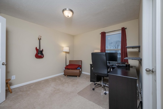 office space with light carpet and a textured ceiling