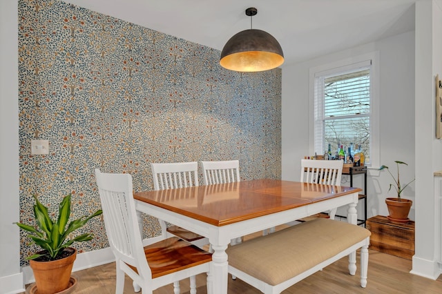 dining area with hardwood / wood-style flooring