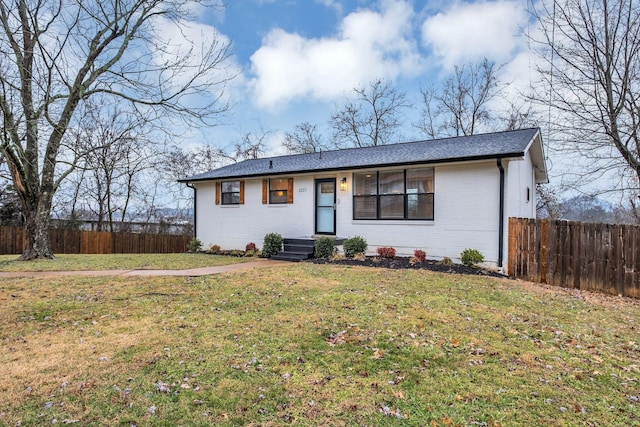 single story home with a front yard