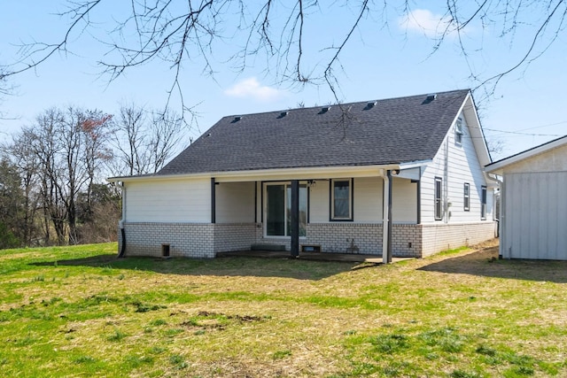 back of house with a porch and a lawn