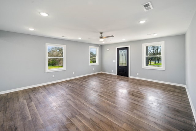 spare room featuring dark hardwood / wood-style floors and ceiling fan