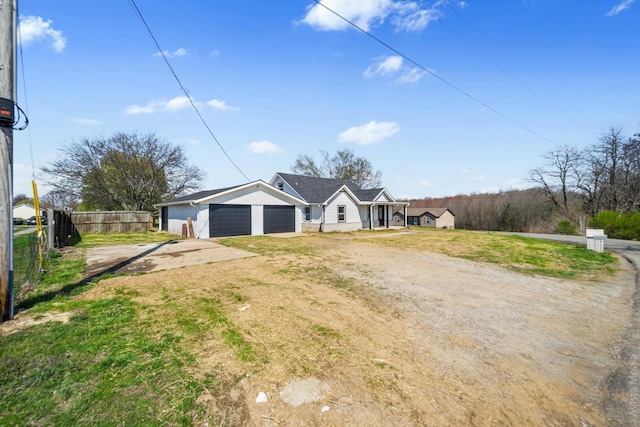 view of front of property featuring a garage and a front yard