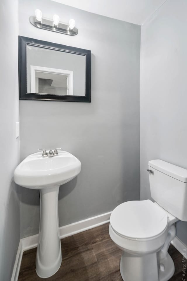 bathroom featuring toilet and hardwood / wood-style floors