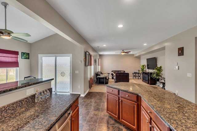 kitchen featuring dark stone countertops and ceiling fan