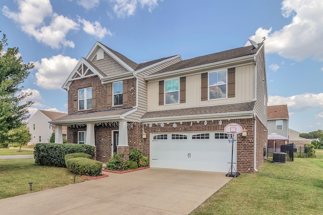 craftsman-style house with cooling unit, a garage, and a front lawn