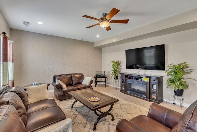 living room featuring light carpet and ceiling fan