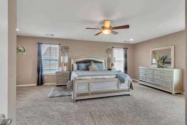 bedroom featuring ceiling fan and light carpet