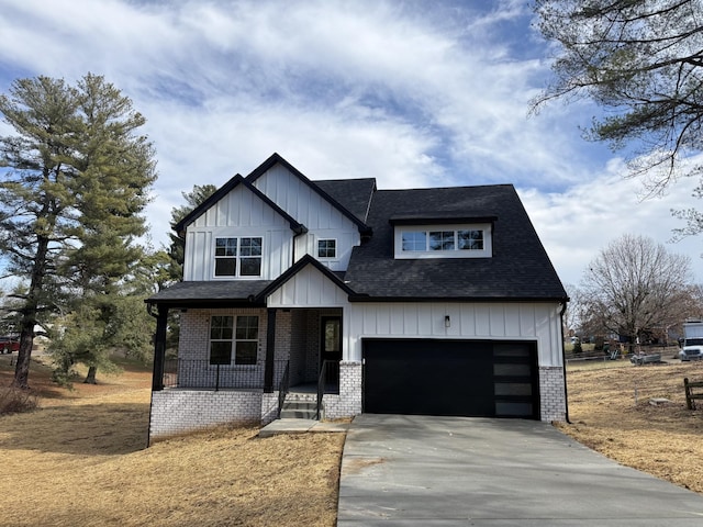 view of front facade featuring a garage and covered porch