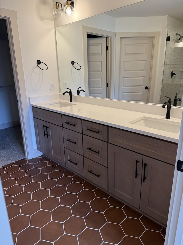 bathroom featuring vanity and a shower with door