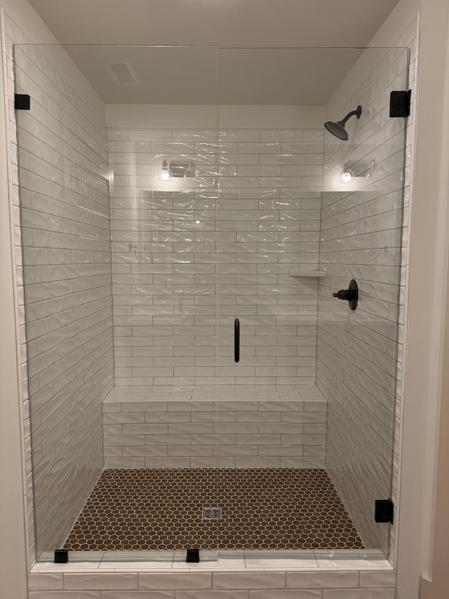 bathroom featuring an enclosed shower