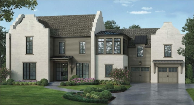 view of front of home featuring a garage and a front yard