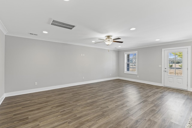 unfurnished room with crown molding, dark hardwood / wood-style floors, and ceiling fan