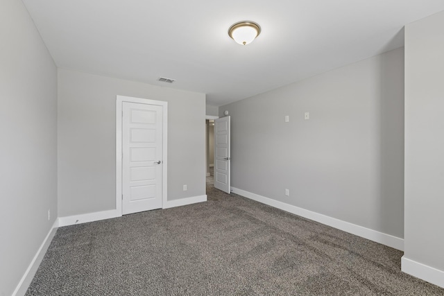 spare room featuring carpet floors