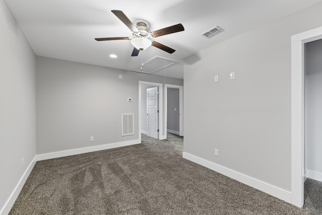 unfurnished room featuring ceiling fan and dark colored carpet