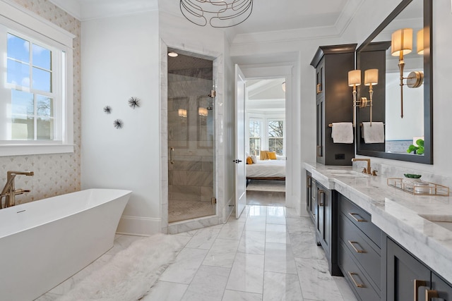 bathroom with ornamental molding, independent shower and bath, and vanity