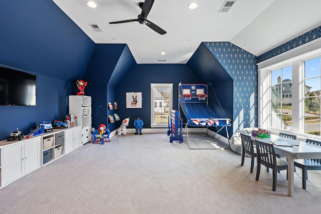 game room featuring lofted ceiling, light colored carpet, and ceiling fan