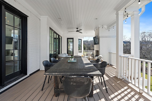 wooden deck featuring ceiling fan