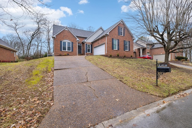 view of front of house with a garage and a front lawn