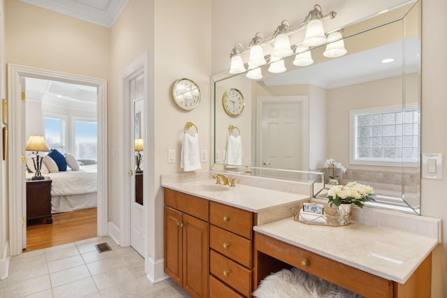 bathroom with vanity, tile patterned floors, and crown molding