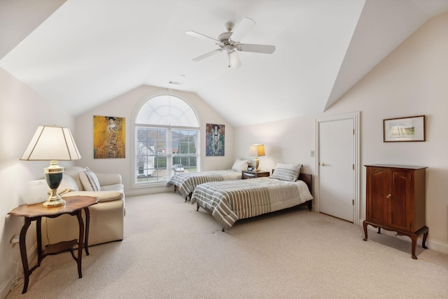 bedroom with ceiling fan, lofted ceiling, and light carpet