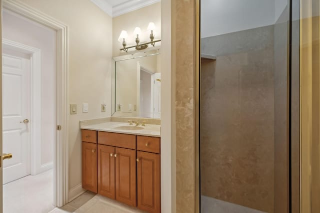 bathroom featuring ornamental molding, a shower, vanity, and baseboards