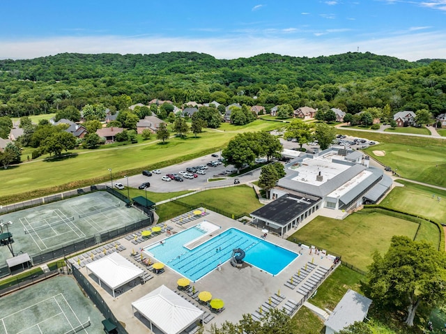 aerial view featuring a wooded view