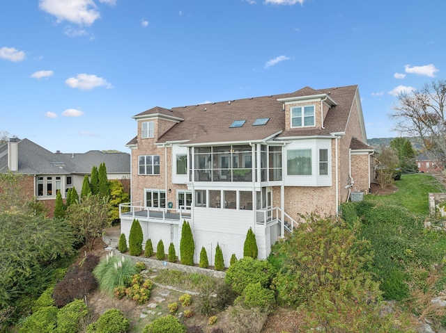 back of property featuring a sunroom