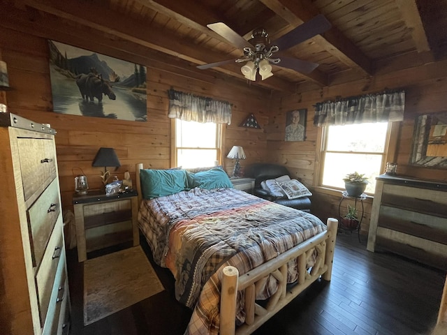 bedroom with beamed ceiling, wood walls, dark hardwood / wood-style flooring, and wooden ceiling