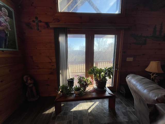 doorway featuring wooden walls