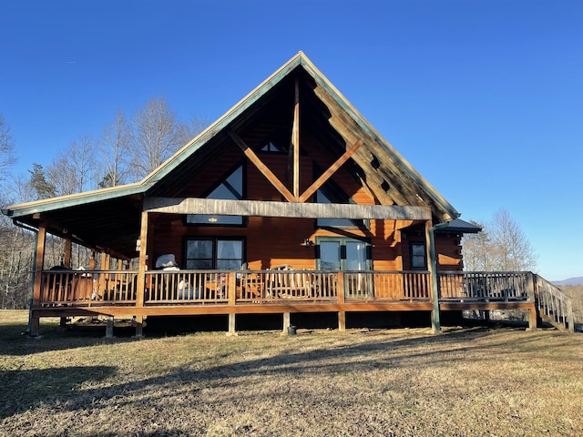 log-style house with a deck