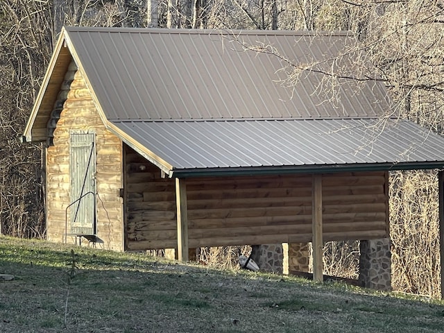 view of home's exterior with an outdoor structure