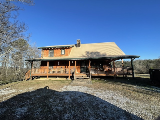 back of house featuring a wooden deck