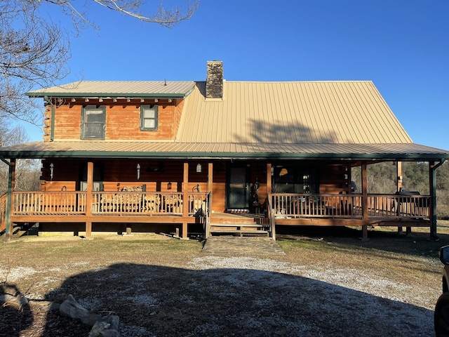 view of front of home with a wooden deck