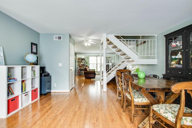 dining area with light hardwood / wood-style flooring and ceiling fan