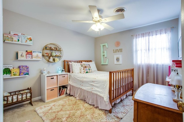 carpeted bedroom featuring ceiling fan