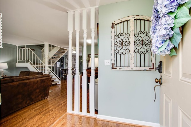 entryway with hardwood / wood-style flooring