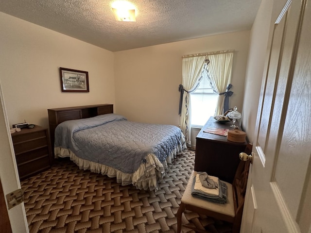 bedroom featuring a textured ceiling