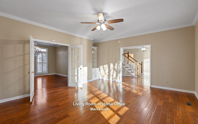 spare room featuring crown molding, ceiling fan with notable chandelier, and dark hardwood / wood-style flooring