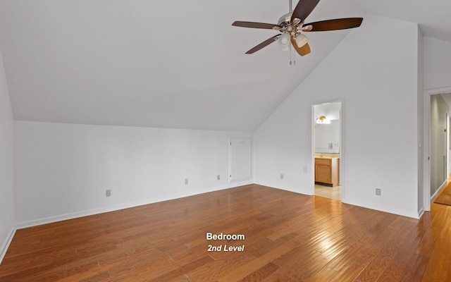 additional living space with lofted ceiling, light hardwood / wood-style flooring, and ceiling fan