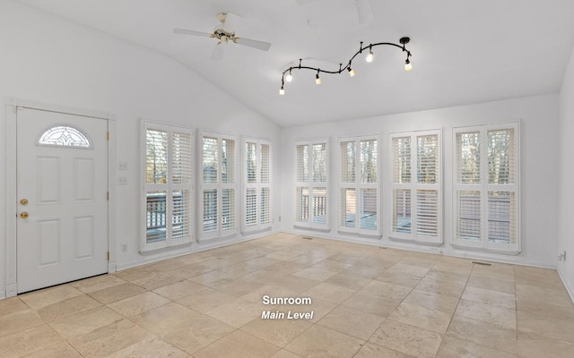 unfurnished sunroom with vaulted ceiling and ceiling fan