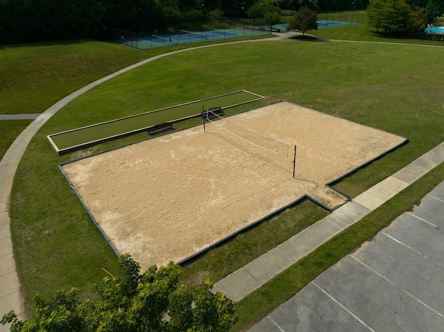 view of community featuring a yard and volleyball court