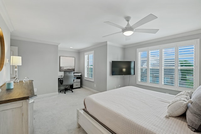 carpeted bedroom featuring ceiling fan and ornamental molding