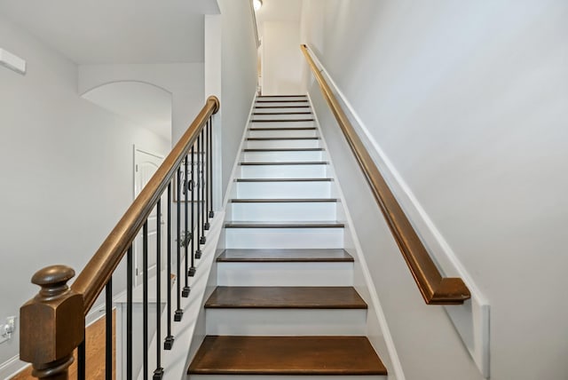 stairs with hardwood / wood-style flooring