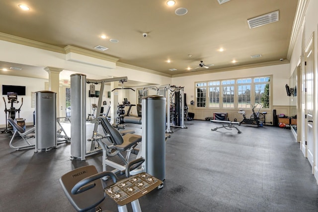 exercise room with ornamental molding, ceiling fan, and ornate columns