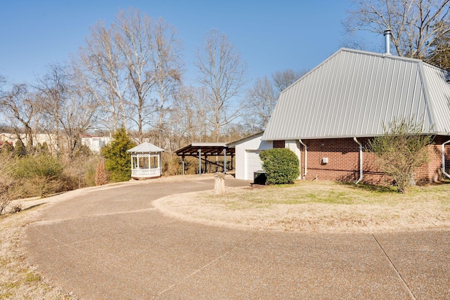 view of home's exterior featuring a carport