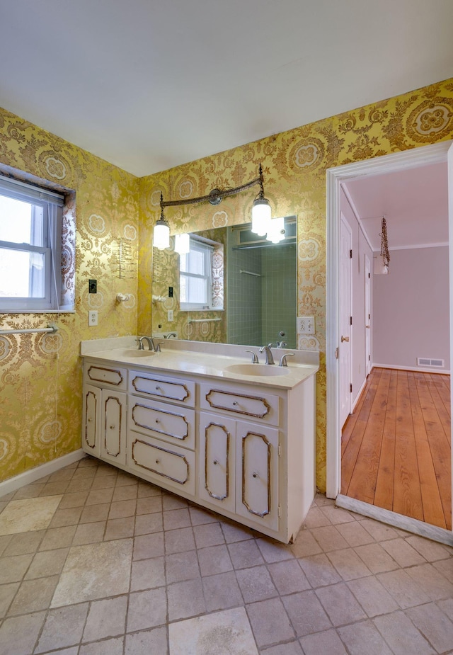 bathroom with vanity and plenty of natural light