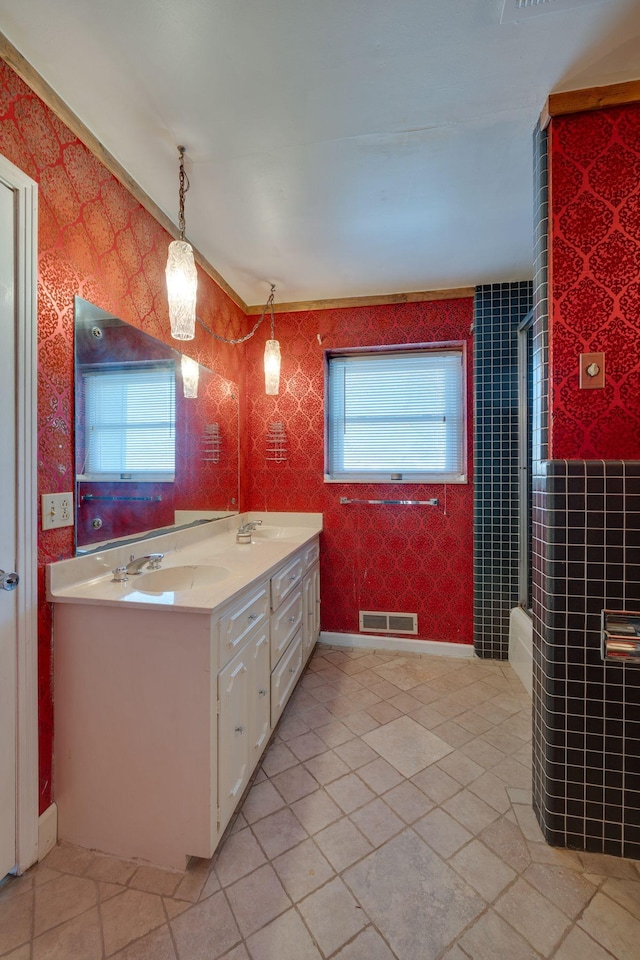 bathroom featuring vanity and shower / bath combination