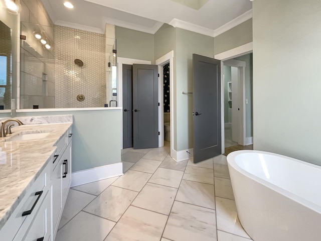 bathroom featuring ornamental molding, vanity, and separate shower and tub