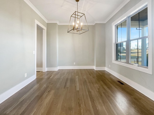 unfurnished dining area with a notable chandelier, crown molding, and dark wood-type flooring