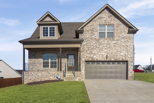 view of front facade with a garage and a front lawn